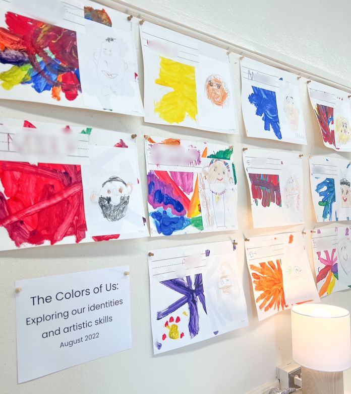 Art display of children's paintings and writing